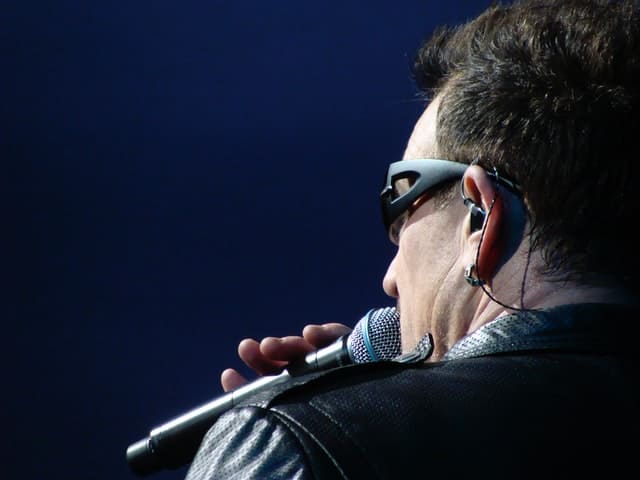 Bono singing in concert